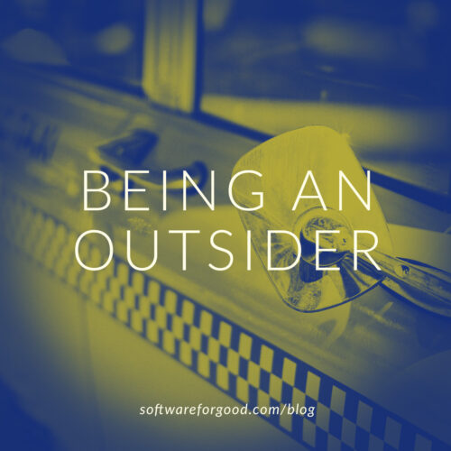 Image of taxi cab door, with words Being An Outsider.
